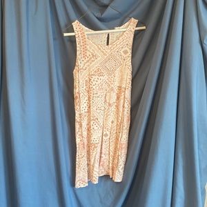 Never worn, long tunic-like tank top with beautiful pattern. Size medium. Boho.